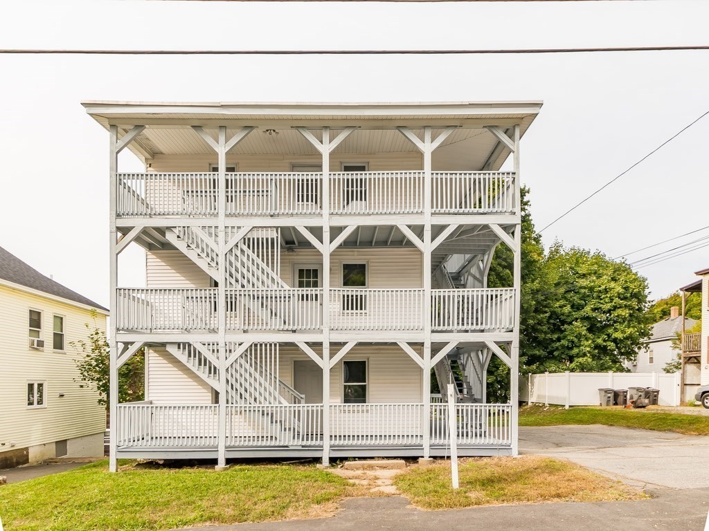 133 Baker Street Gardner, MA 01440 - Photo 1 of 10 a front view of a house with swimming pool
