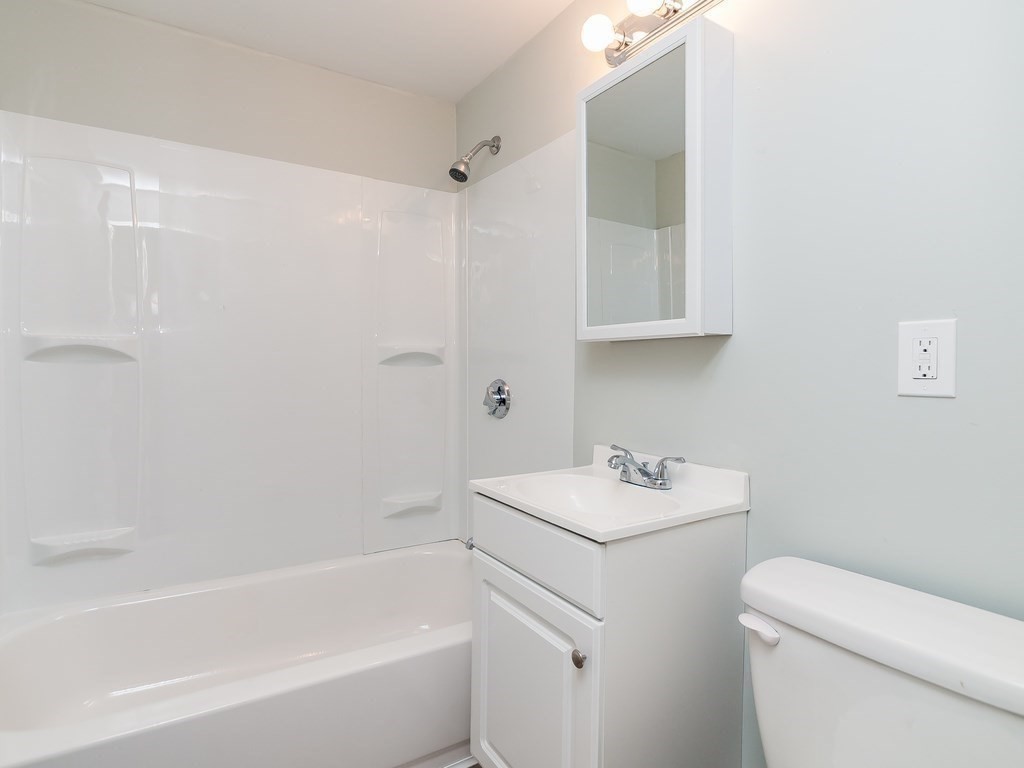 133 Baker Street Gardner, MA 01440 - Photo 7 of 10 a bathroom with a sink toilet and vanity
