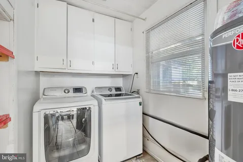 a view of a porch with a wooden bench and floor