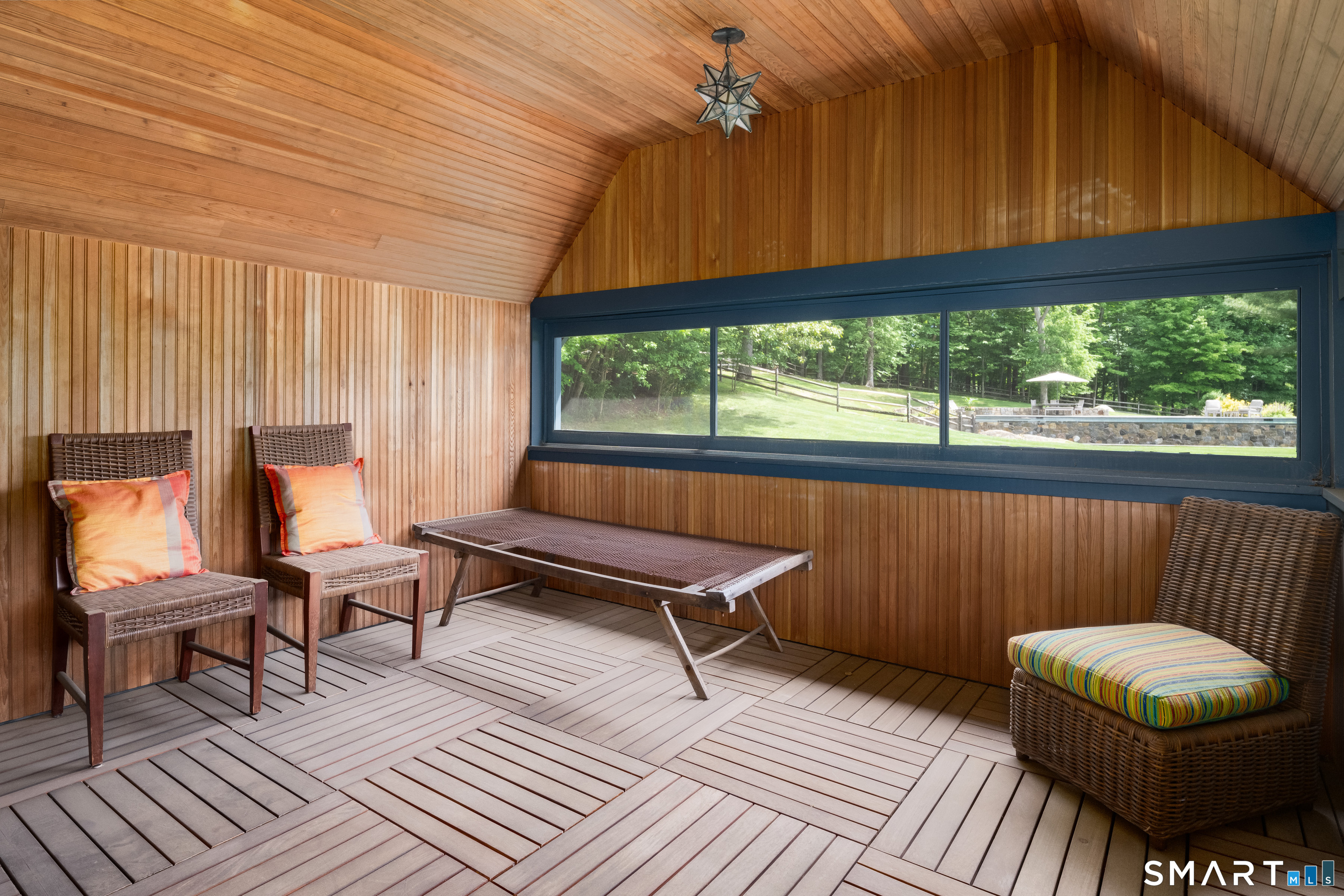 240 Umpawaug Road Redding, CT 06896 - Photo 19 of 40 The sleeping porch. Cedar headboard, vaulted ceiling, windows screened and with glass inserts.