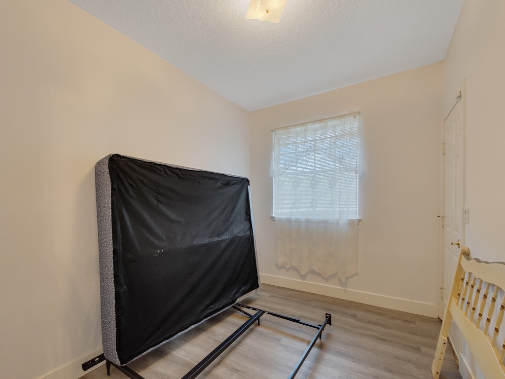 167 Deer Run Road Palm Bay, FL 32909 - Photo 16 of 35 a room with wooden floor and window