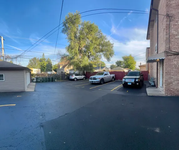 a view of street with parked cars