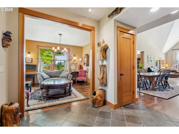 a living room with furniture a rug and a large window