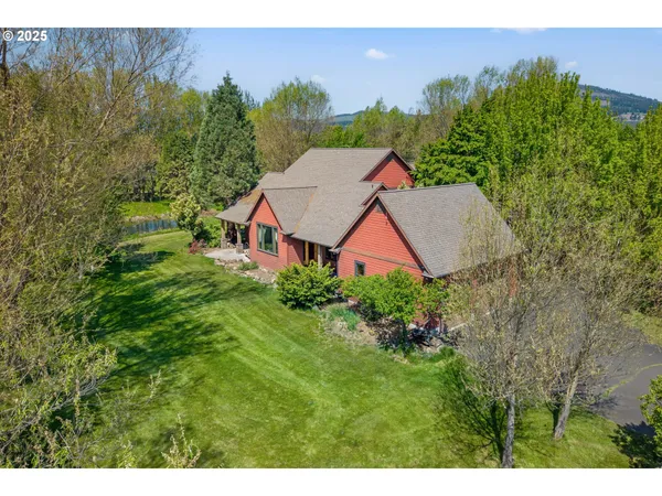 a aerial view of a house with garden space and street view