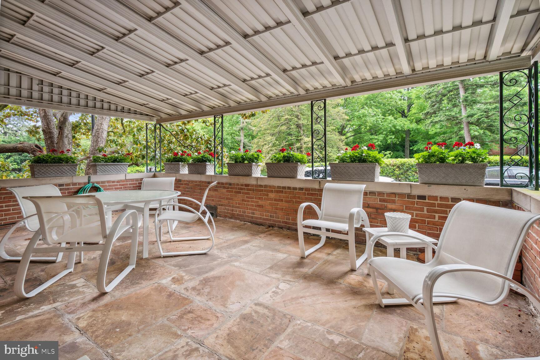 4301 Massachusetts Avenue Northwest, Unit 1008 Washington, DC 20016 - Photo 1 of 21 a view of a patio with chairs and backyard