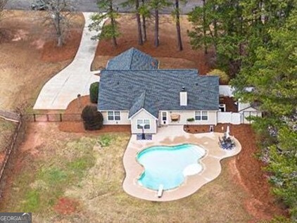 30 Old Mill Way Senoia, GA 30276 - Photo 1 of 29 a backyard of a house with table and chairs