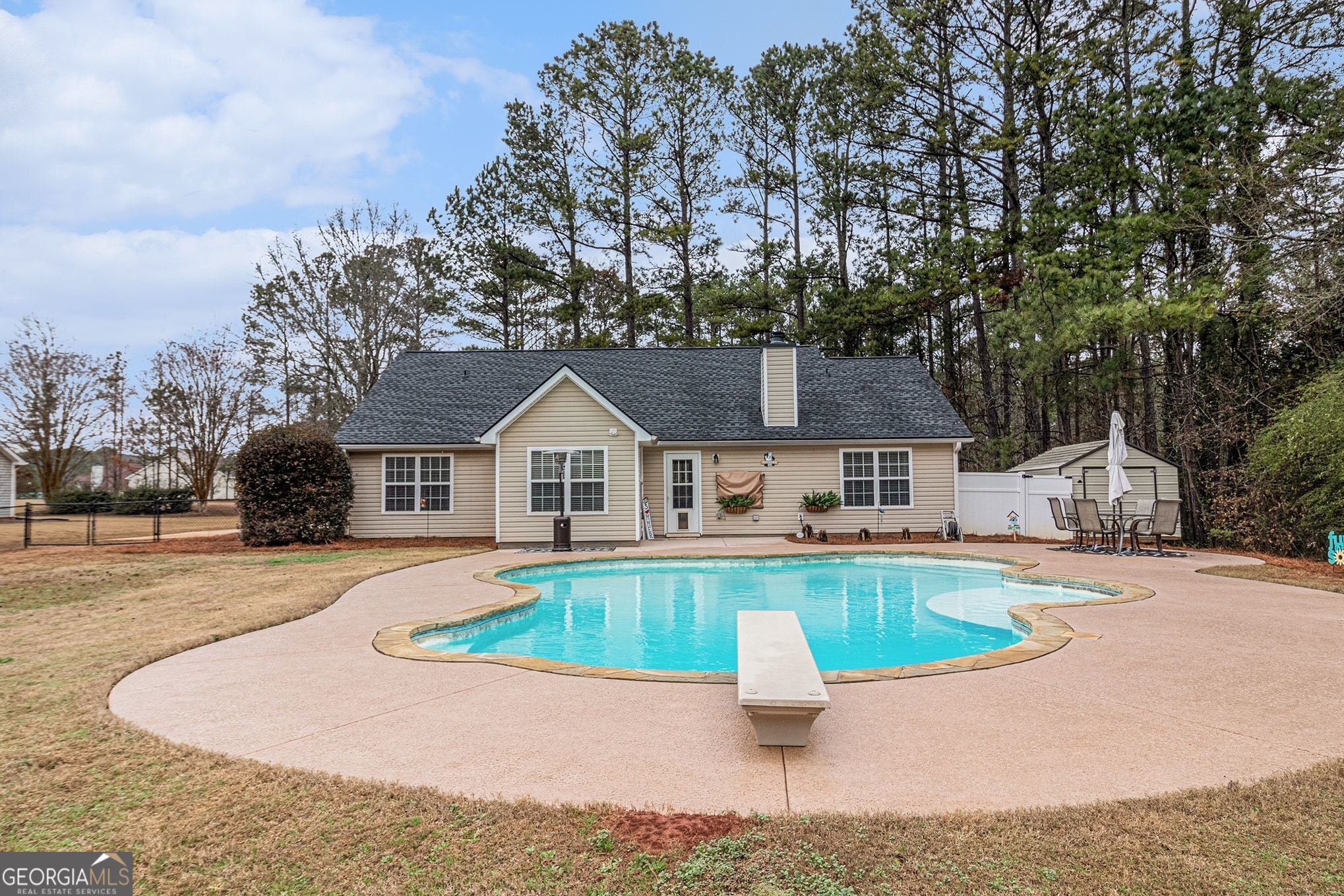 30 Old Mill Way Senoia, GA 30276 - Photo 21 of 29 a front view of house with yard and trees in the background