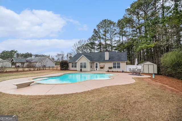 a view of pool and outdoor space
