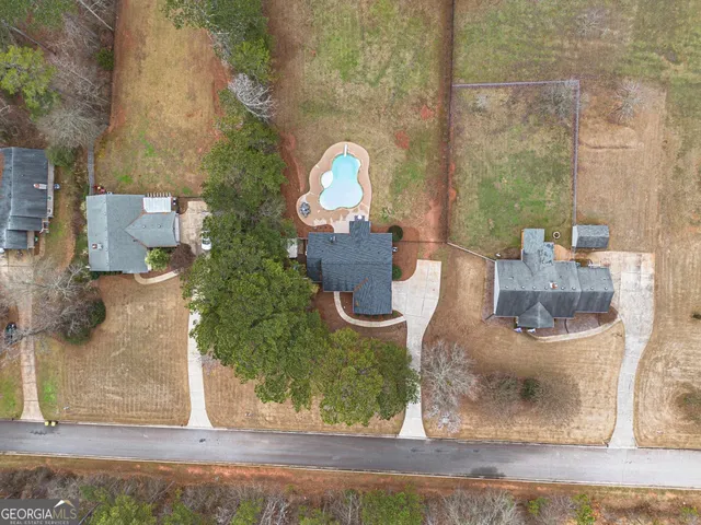 a view of a small pool with a yard