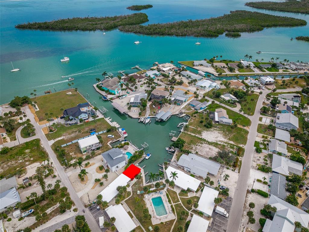 1385 Gulf Boulevard, Unit 10 Englewood, FL 34223 - Photo 1 of 36 an aerial view of a house with a lake view