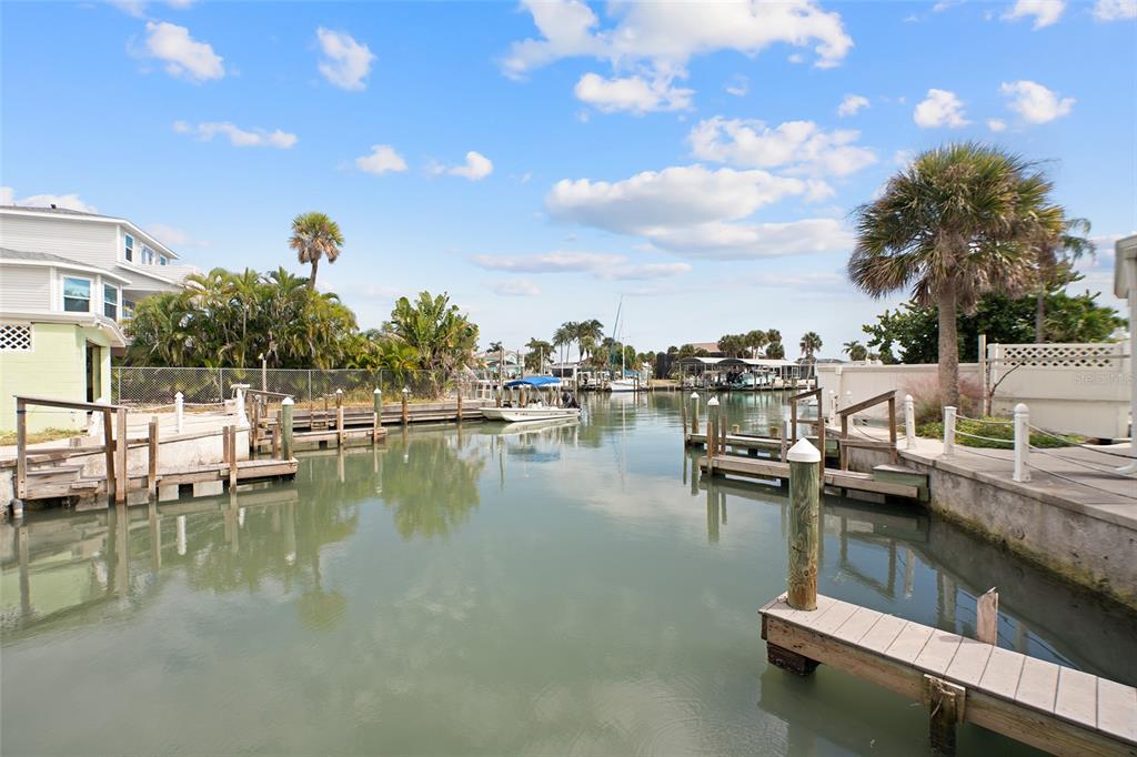 1385 Gulf Boulevard, Unit 10 Englewood, FL 34223 - Photo 17 of 36 a view of a lake with boats and trees