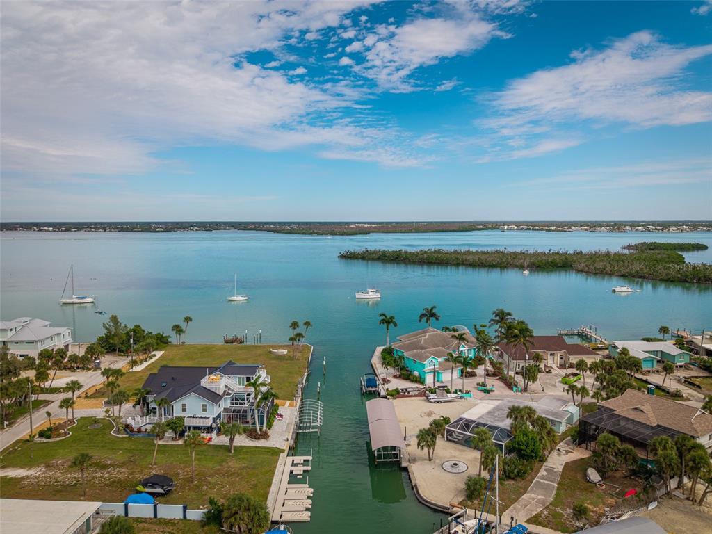1385 Gulf Boulevard, Unit 10 Englewood, FL 34223 - Photo 18 of 36 a view of a lake with outdoor space