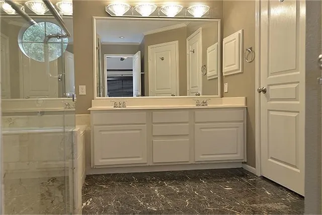 view of a bathroom with mirror and window