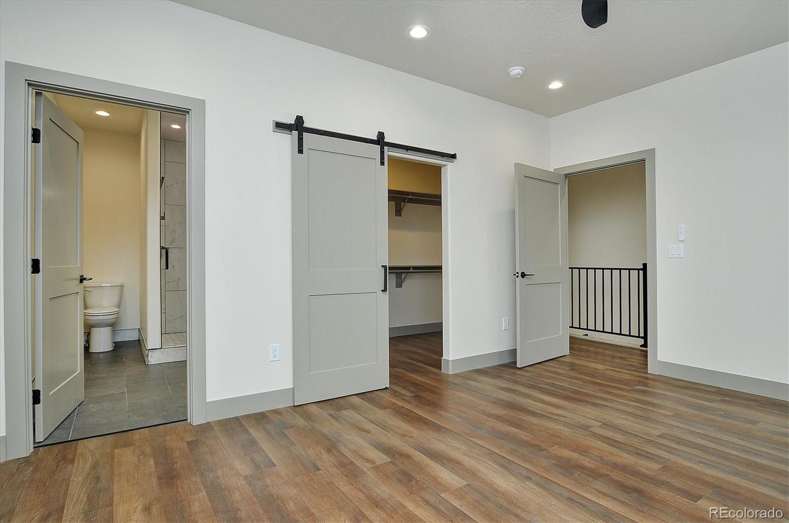 6398 Cleora Road, Unit G Salida, CO 81201 - Photo 24 of 34 wooden floor in an empty room with an empty room