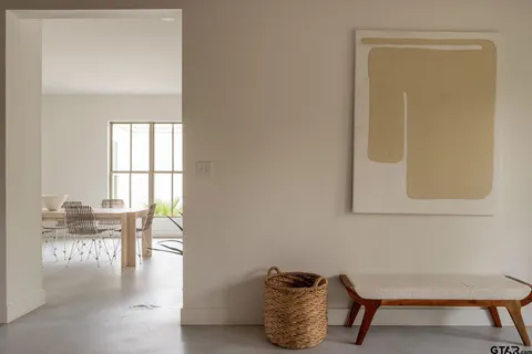 a room with furniture and a potted plant