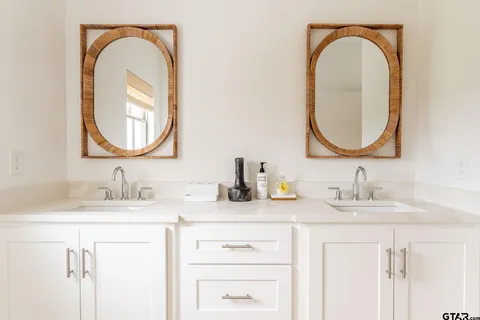 a living room with furniture tv and a window