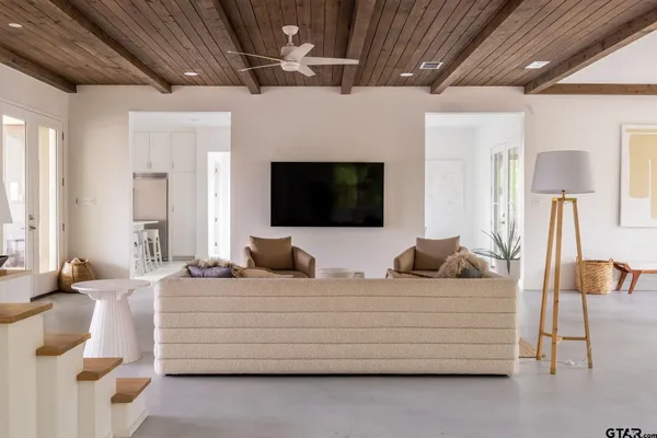 a bed room with a bed and a chair