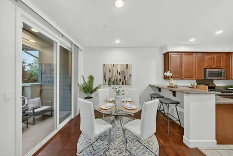 a view of a dining room with furniture window and wooden floor