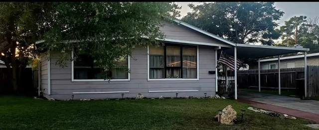a backyard of a house with lots of green space