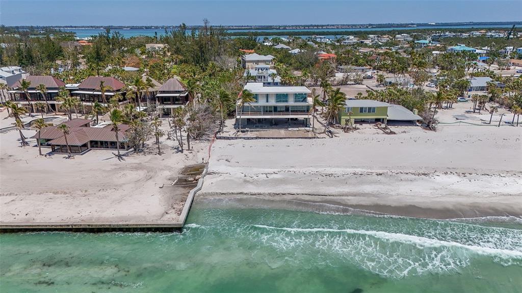 6603 Gulfside Road Longboat Key, FL 34228 - Photo 15 of 40 an aerial view of a house with a yard and lake view