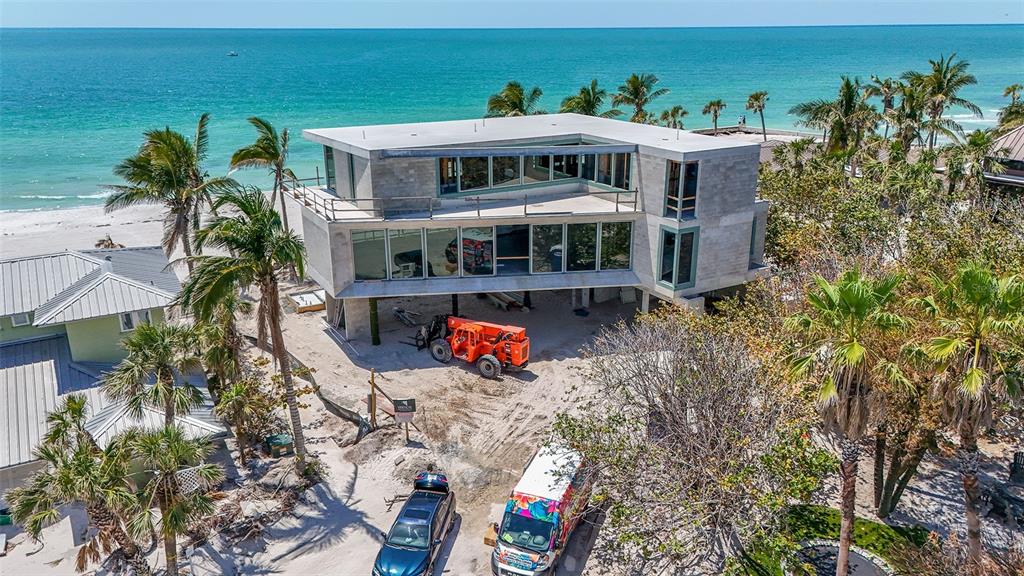 6603 Gulfside Road Longboat Key, FL 34228 - Photo 21 of 40 an aerial view of a house with a yard