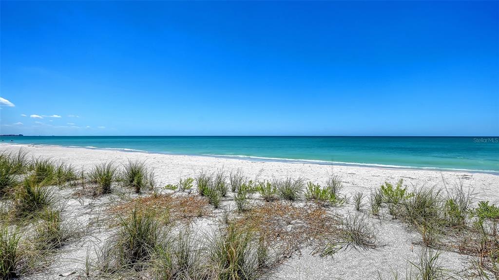 6603 Gulfside Road Longboat Key, FL 34228 - Photo 39 of 40 a view of a lake with a yard