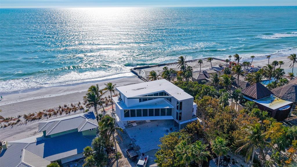 6603 Gulfside Road Longboat Key, FL 34228 - Photo 7 of 40 a view of a terrace with lawn chairs