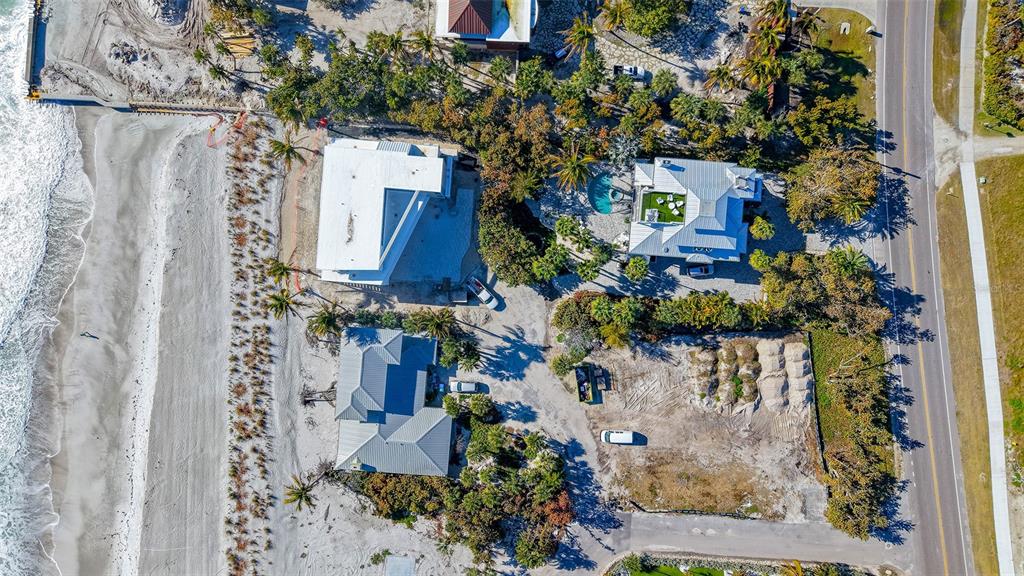 6603 Gulfside Road Longboat Key, FL 34228 - Photo 8 of 40 a view of a house with a tree