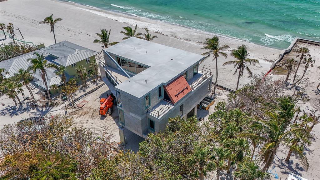 6603 Gulfside Road Longboat Key, FL 34228 - Photo 10 of 40 an aerial view of a house with a yard