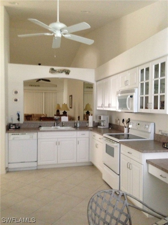 8088 Ibis Cove Circle, Unit 804 Naples, FL 34119 - Photo 18 of 27 a kitchen with granite countertop a sink cabinets and stainless steel appliances