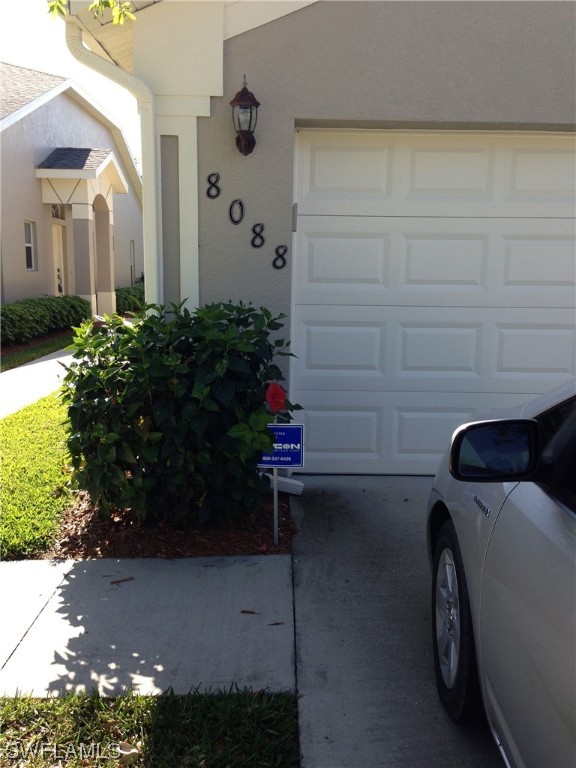 8088 Ibis Cove Circle, Unit 804 Naples, FL 34119 - Photo 2 of 27 a view of a house with a backyard
