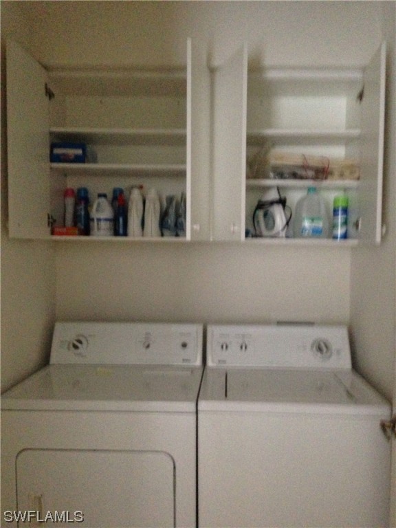 8088 Ibis Cove Circle, Unit 804 Naples, FL 34119 - Photo 23 of 27 a close view of utility room with two washing machine