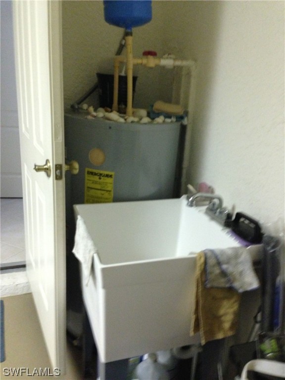 8088 Ibis Cove Circle, Unit 804 Naples, FL 34119 - Photo 24 of 27 a bed sitting in a bedroom next to a window