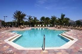 8088 Ibis Cove Circle, Unit 804 Naples, FL 34119 - Photo 26 of 27 a view of a lake with houses