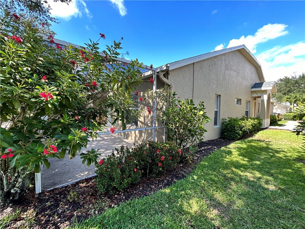 8088 Ibis Cove Circle, Unit 804 Naples, FL 34119 - Photo 8 of 27 a house view with a backyard space