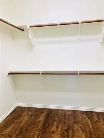 a view of a room with an empty walk in closet