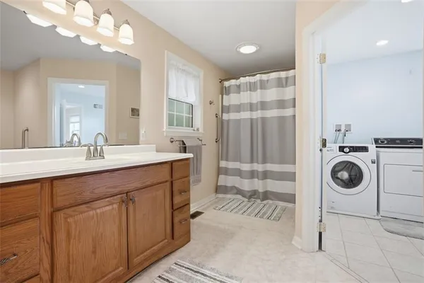 a bathroom with a toilet and a mirror