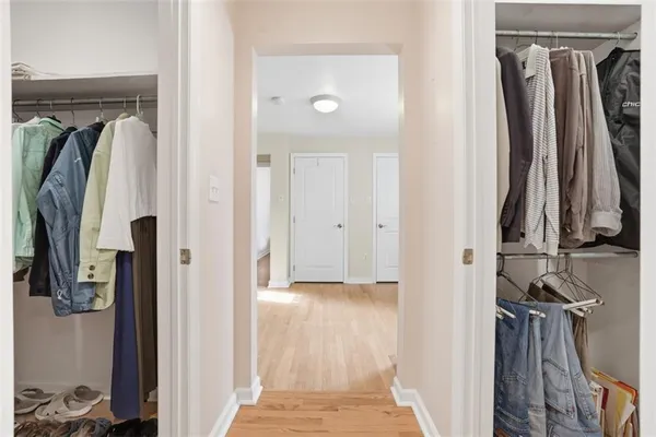 a view of an empty room with closet area