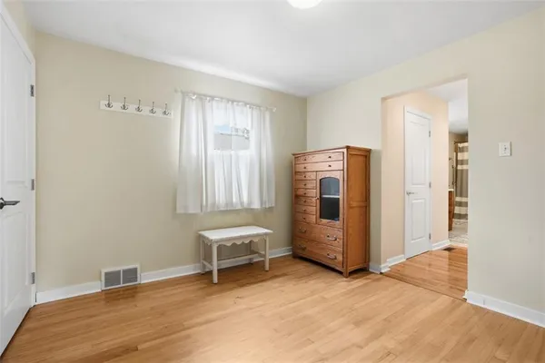 an empty room with a wooden door