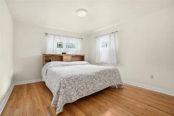 a bedroom with a bed and a view of bathroom