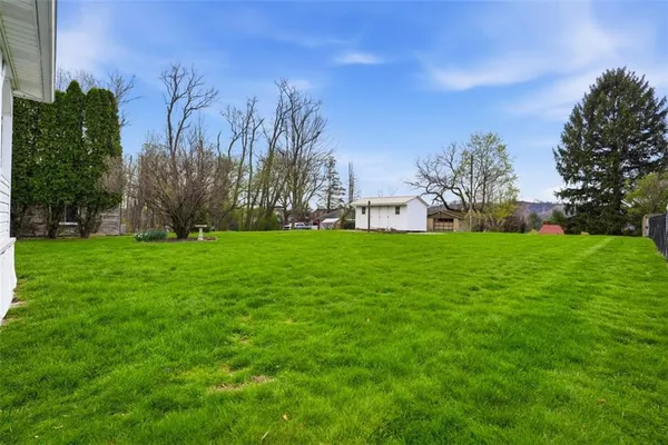 a view of a house with a big yard