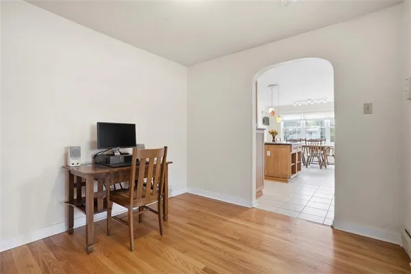a view of a dining room with furniture and wooden floor