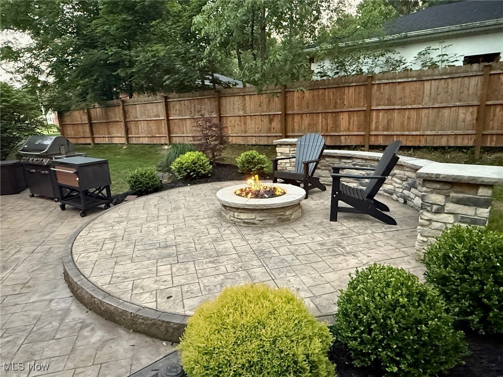 10620 Ridge Road North Royalton, OH 44133 - Photo 31 of 35 View of patio featuring a fire pit and a grill