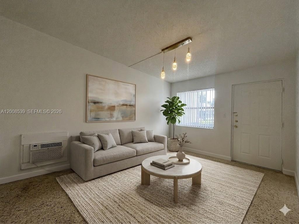 142 Southwest 18th Avenue, Unit 20 Miami, FL 33135 - Photo 2 of 8 a living room with furniture and a potted plant