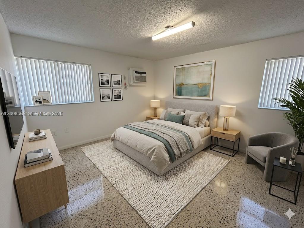 142 Southwest 18th Avenue, Unit 20 Miami, FL 33135 - Photo 4 of 8 a bedroom with a bed and wooden floor
