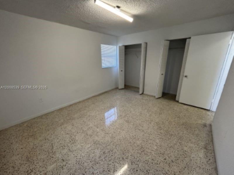 142 Southwest 18th Avenue, Unit 20 Miami, FL 33135 - Photo 6 of 8 an empty room with windows