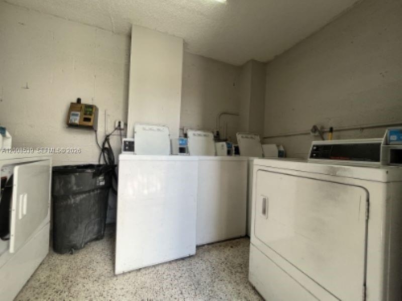 142 Southwest 18th Avenue, Unit 20 Miami, FL 33135 - Photo 8 of 8 a utility room with dryer and washer