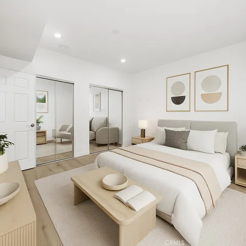 a bedroom with a bed chair and window