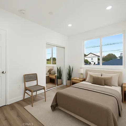 a bedroom with a bed and a desk