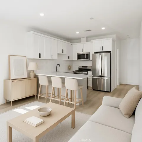 a bedroom with a large bed and a potted plant